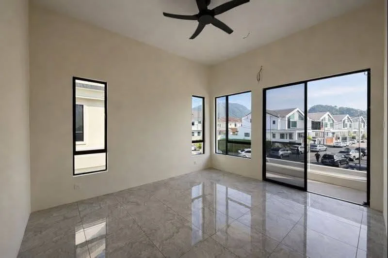 Pulai Height bedroom with limestone hill view through sliding door, real photograph